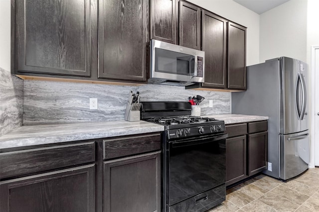 kitchen with appliances with stainless steel finishes, backsplash, and dark brown cabinetry