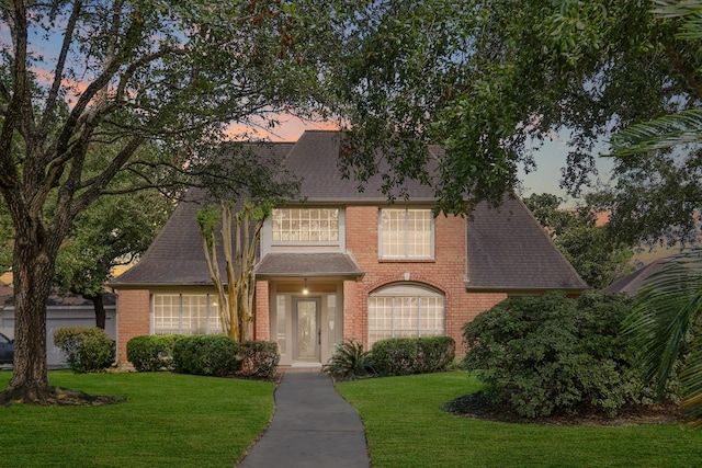 view of front of property with a lawn