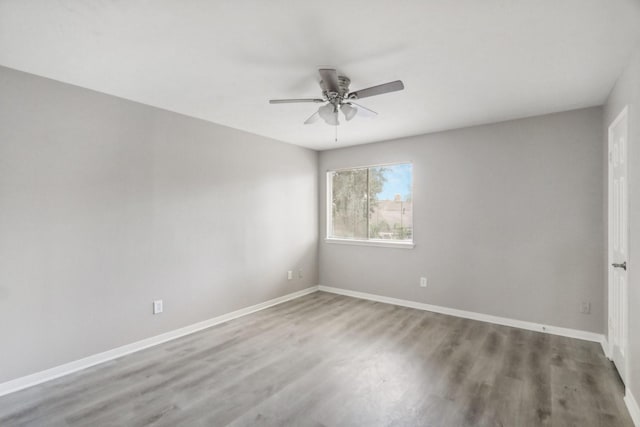 unfurnished room with wood-type flooring and ceiling fan