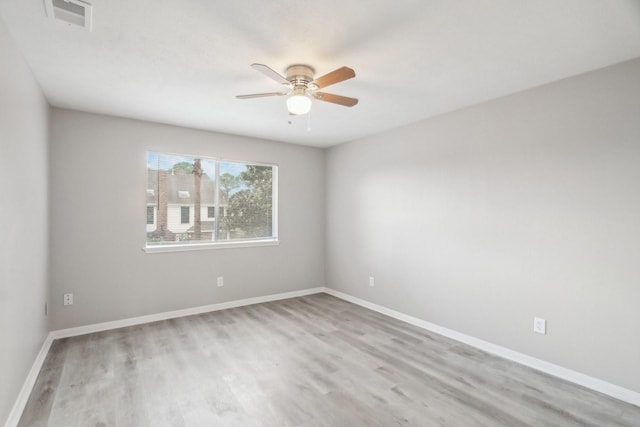 unfurnished room featuring light hardwood / wood-style floors and ceiling fan