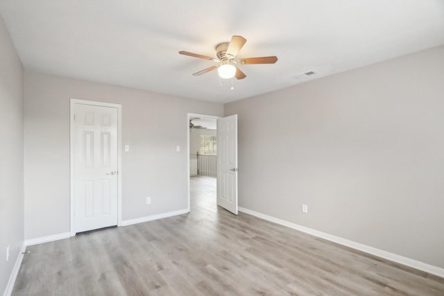 unfurnished bedroom featuring light hardwood / wood-style flooring and ceiling fan