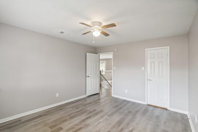 unfurnished bedroom with ceiling fan and light hardwood / wood-style flooring