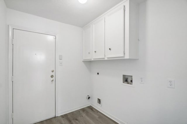 laundry room with cabinets, hookup for a washing machine, light wood-type flooring, electric dryer hookup, and hookup for a gas dryer