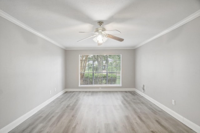 empty room featuring ceiling fan, light wood-type flooring, and crown molding