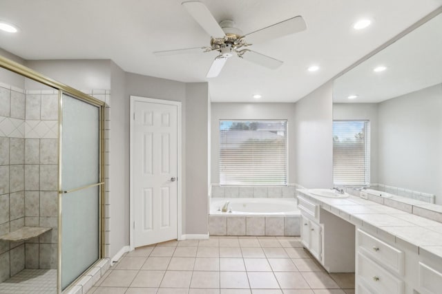 bathroom with tile patterned flooring, vanity, separate shower and tub, and ceiling fan