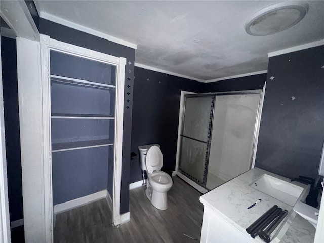 bathroom featuring crown molding, toilet, vanity, and hardwood / wood-style flooring