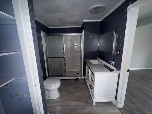 bathroom with hardwood / wood-style flooring, vanity, and toilet