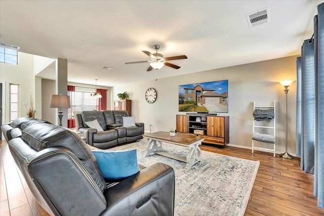 living room featuring ceiling fan and wood-type flooring