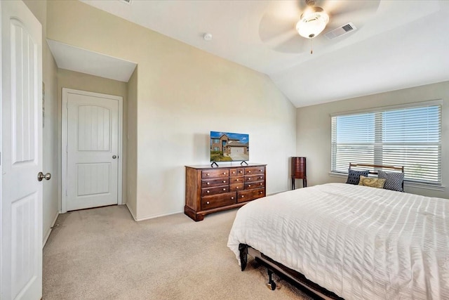 bedroom featuring ceiling fan, light colored carpet, and lofted ceiling