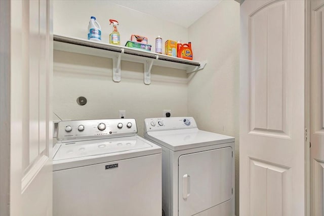 laundry room featuring washer and clothes dryer