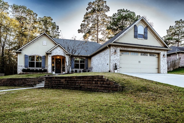 view of front facade featuring a garage and a front lawn