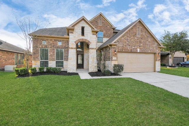 view of front of property featuring a garage and a front yard