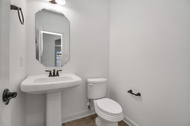 bathroom featuring toilet