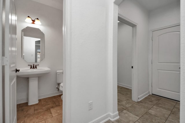 bathroom with sink and toilet