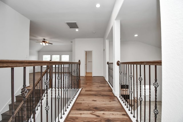 corridor with wood-type flooring