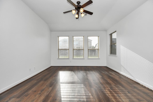 spare room with dark hardwood / wood-style flooring, ceiling fan, and lofted ceiling