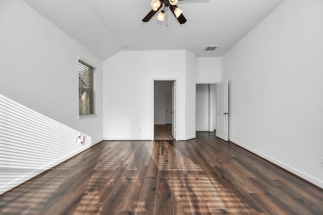 unfurnished bedroom with ceiling fan, dark hardwood / wood-style flooring, and lofted ceiling