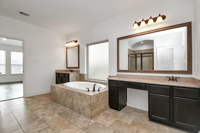 bathroom with separate shower and tub, tile patterned flooring, and vanity