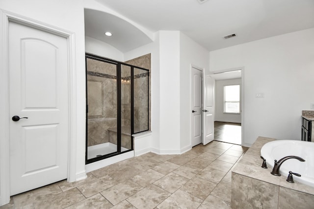 bathroom featuring plus walk in shower