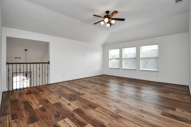 empty room featuring ceiling fan, dark wood-type flooring, and lofted ceiling