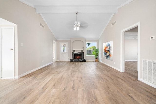 unfurnished living room with vaulted ceiling with beams, ceiling fan, light hardwood / wood-style floors, and ornamental molding