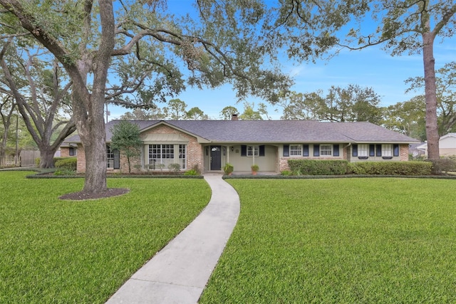 ranch-style house with a front yard