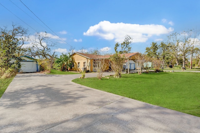 ranch-style home with a front yard and a garage