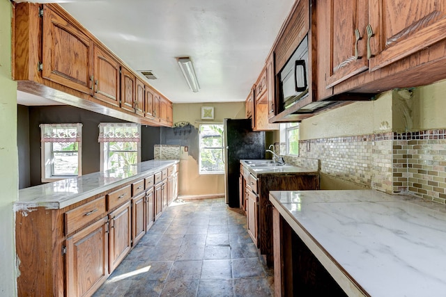 kitchen with decorative backsplash and sink