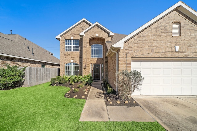 view of front property with a garage and a front lawn