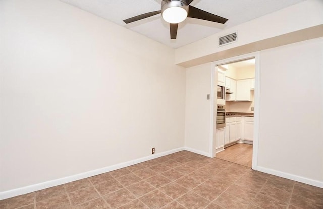 unfurnished room featuring ceiling fan