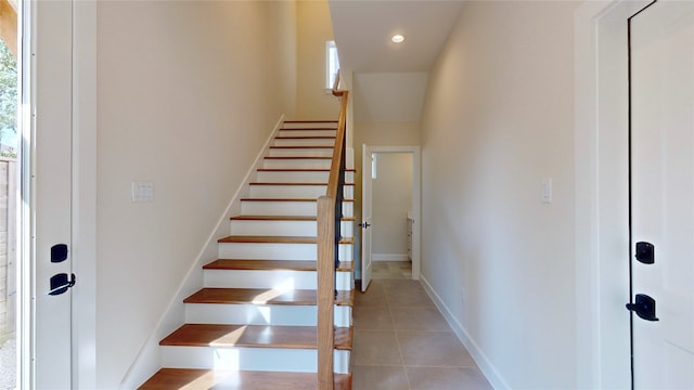 stairs with tile patterned floors