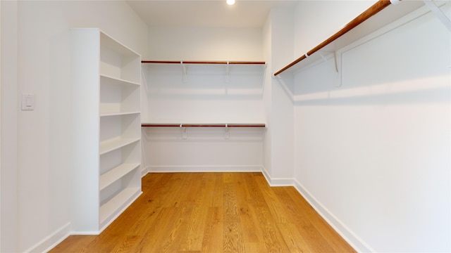 spacious closet featuring light hardwood / wood-style flooring