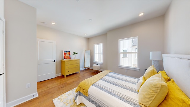 bedroom with light hardwood / wood-style flooring