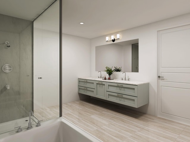 bathroom featuring vanity and independent shower and bath