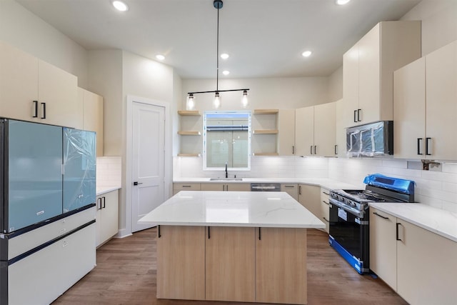 kitchen with wood finished floors, a kitchen island, open shelves, a sink, and stainless steel appliances