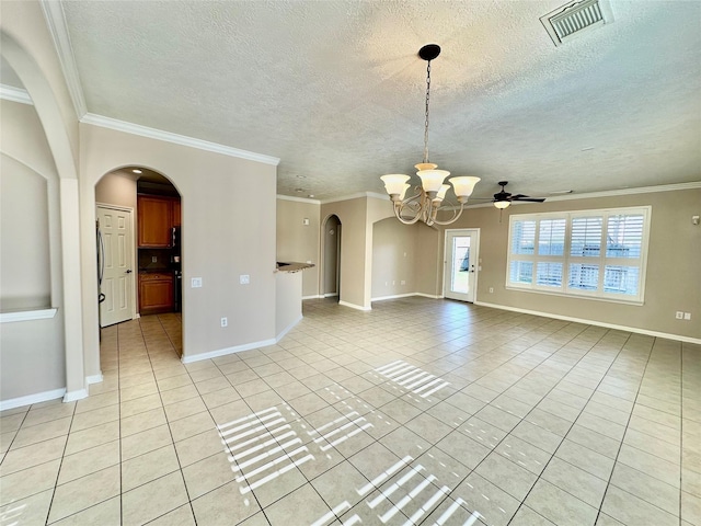 empty room with light tile patterned floors and crown molding