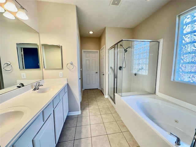 bathroom featuring tile patterned flooring, vanity, and independent shower and bath