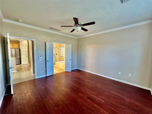 unfurnished bedroom featuring stainless steel refrigerator, ceiling fan, ensuite bathroom, light hardwood / wood-style floors, and ornamental molding