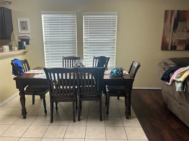 dining area featuring light tile patterned floors