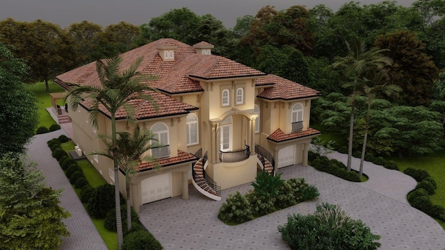 mediterranean / spanish house with a garage