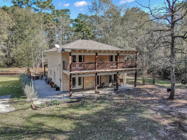 back of house with french doors, a yard, a deck, and a patio area