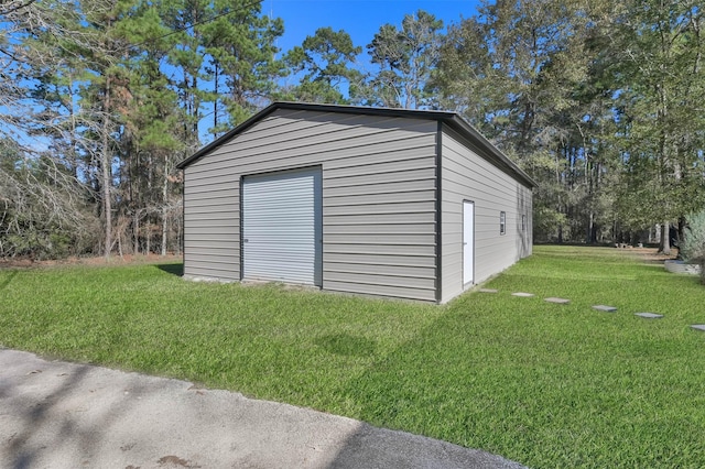 garage with a yard