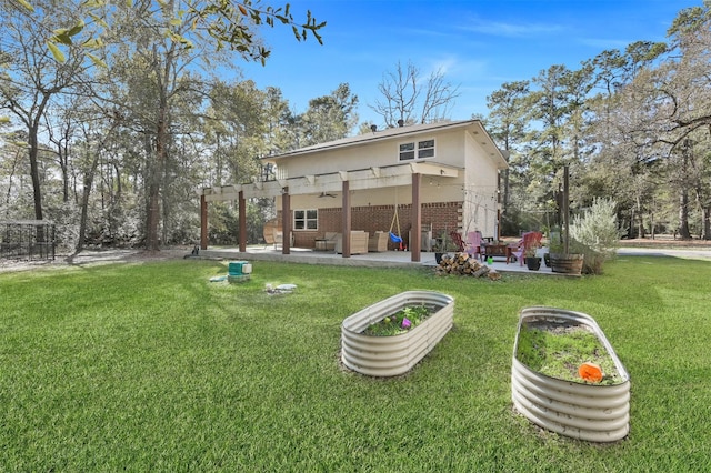 back of house featuring a yard, a pergola, an outdoor hangout area, and a patio area