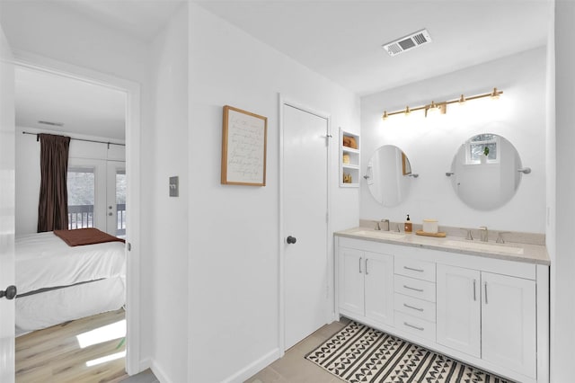 bathroom with tile patterned flooring and vanity