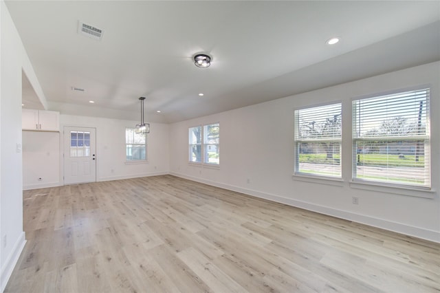 unfurnished room featuring light hardwood / wood-style flooring