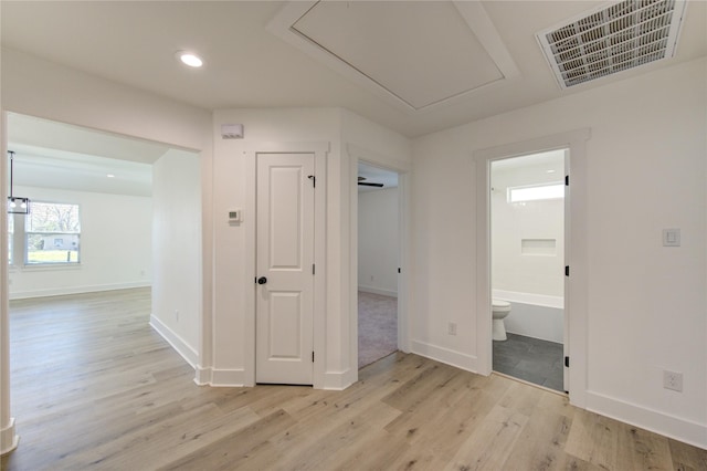 corridor with light wood-type flooring