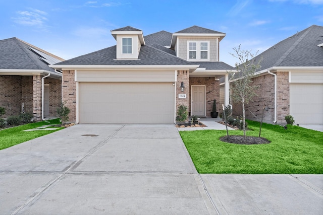 view of front of property featuring a garage and a front lawn