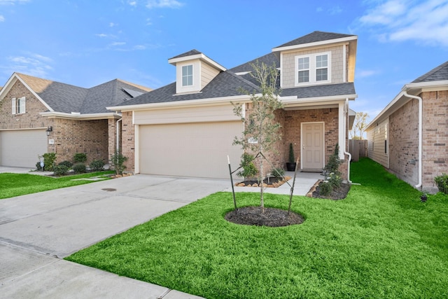 view of front of house featuring a front yard and a garage