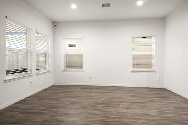 empty room featuring dark hardwood / wood-style flooring