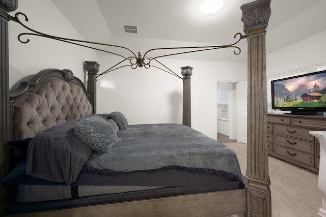 bedroom with light carpet and vaulted ceiling